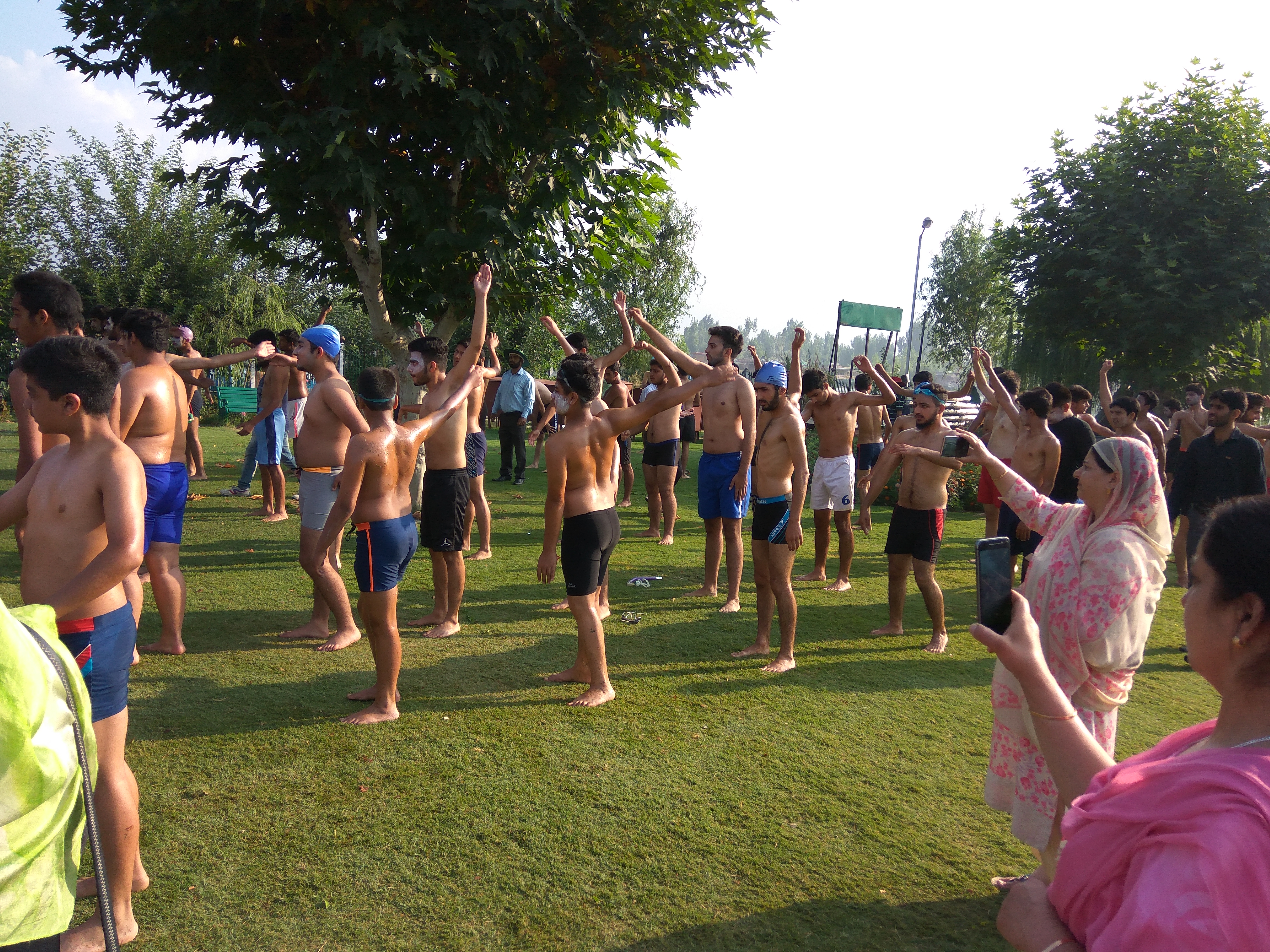 Students exercising before going into the lake for the annual Dal Swims.